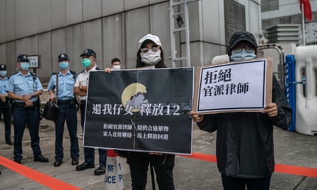 Family members of Hong Kong residents detained in China protest outside the Beijing liaison office on 30 September.