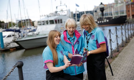 On Hull marina volunteers look at the programme for Hull UK City of Culture 2017, which will focus national attention on the city