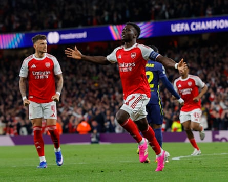 Bukayo Saka of Arsenal celebrates after opening the scoring during the Champions League semi-final second leg match against Atletico Madrid.