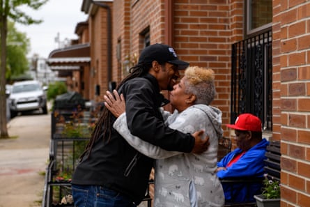 Mike Africa Jr greets a neighbor on Osage Avenue.