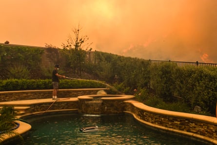 a person holding a garden hose