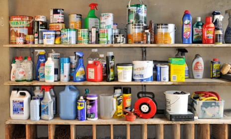 Interior of domestic garage storage shelves with varioius paint diy products.