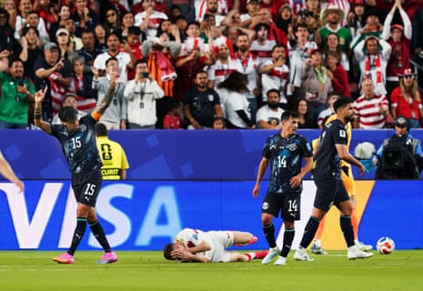 Turkey's Kerem Akturkoglu reacts after sustaining an injury.