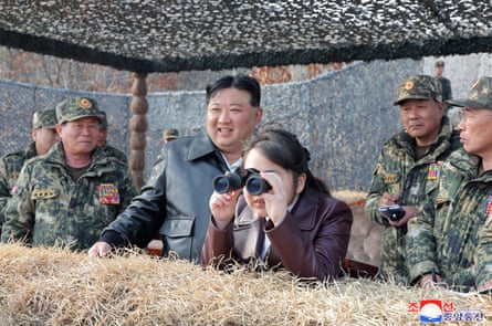 Kim Jong-un and his daughter Kim Ju-ae inspect a military exercise