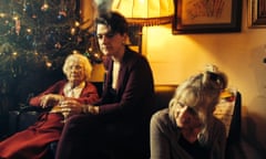 Nell Frizzell with her mother and grandmother by a Christmas tree