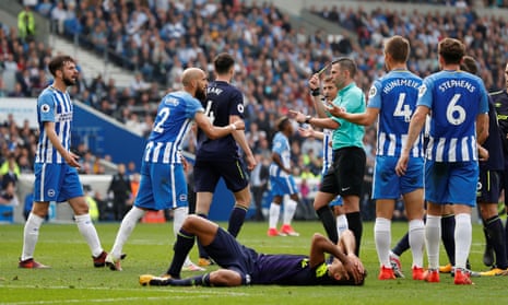The Brighton captain Bruno, No 2, approaches Michael Oliver after the referee awarded Everton their late penalty. 