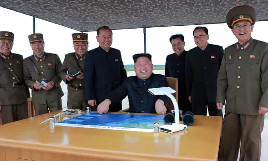 North Korean leader Kim Jong-un oversees the launch of a Hwasong-12 rocket with senior commanders in this image from August last year. Three top generals have been sacked, according to the US and South Korea. 