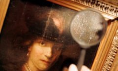 A magnifying glass shows the signature on a painting which is believed by Russian and Ukrainian art experts to have been painted by Rembrandt in Dnepropetrovsk January 25, 2007. A museum in Dnipropetrovsk bought the picture from an undentified man, paying 10 roubles during the Soviet era in 1968. REUTERS/Gleb Garanich (UKRAINE)