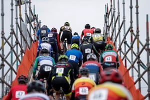Riders in the men's 55-59 category climb one of the temporary bridges