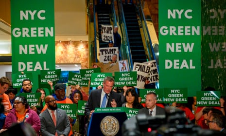 New York City’s mayor, Bill de Blasio, speaks inside Trump Tower about the Green New Deal on 13 May.