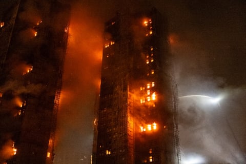 Firefighters try to extinguish a fire that broke out at Wang Fuk Court