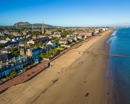 An aerial view of the beach, water and seafront in Portobello