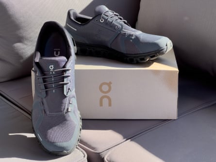 On Cloud 6 slip on shoes next to box on couch