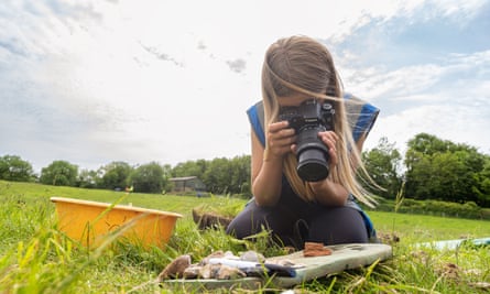 A girl photography finds from an archaeological dig