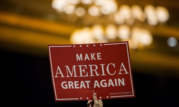  'I've started to look on the bright side and it makes me despise myself': an attendee holds a sign up at a Trump campaign rally. Photograph: Bloomberg/Bloomberg via Getty Images