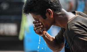 Photo by Debarchan Chatterjee/NurPhoto/REX/Shutterstock
A man is seen splashing water on his face to escape from severe heatwave in Kolkata, India, on 29 April 2022.