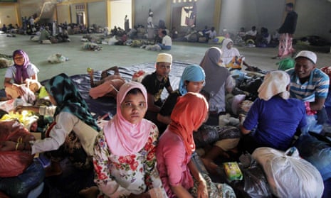 Rohingya refugees get some rest in a stadium in Aceh, Indonesia on Wednesday. The UN’s refugee body said that between January and March this year, almost 25,000 Rohingya and Bangladeshis boarded smugglers’ boats.