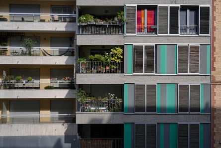 Closed windows and drawn shutters on a building in Paris’s 19th arondissement.