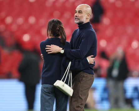 Pep Guardiola celebrates winning the Carabao Cup with his daughter.