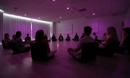 Participants meditate during a class at Unplug, a new meditation studio in Los Angeles.