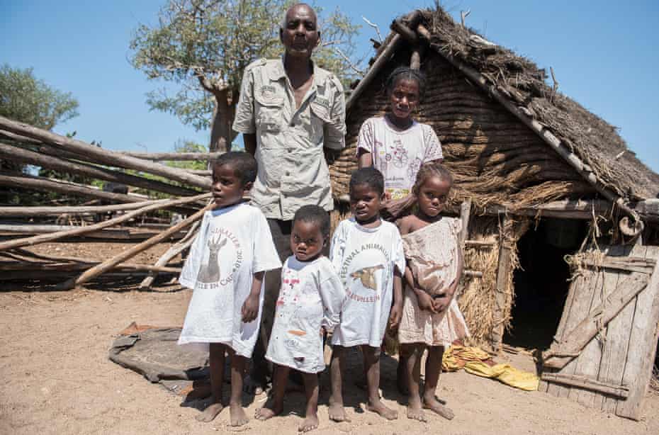 Lahie together with his wife, Njomasy, and their children, from left, Vorito 3, Lovasoa 2, Fanampesoa 3 and Rasoa 5, stand in front of their house in Satrie village.