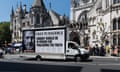 A van with a billboard showing a picture and pro-Assange messages drives past the royal courts of justice in London as the high court granted him a right to a full appeal against the US's extradition order on 20 May 2024