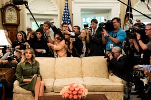 Washington DC, USFirst Lady Melania Trump sits patiently on the sofa as her husband President Donald Trump speaks to the press in the Oval Office of the White House