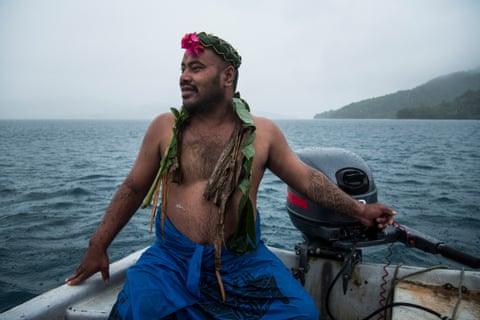 man sits in boat off Kioa, Fiji
