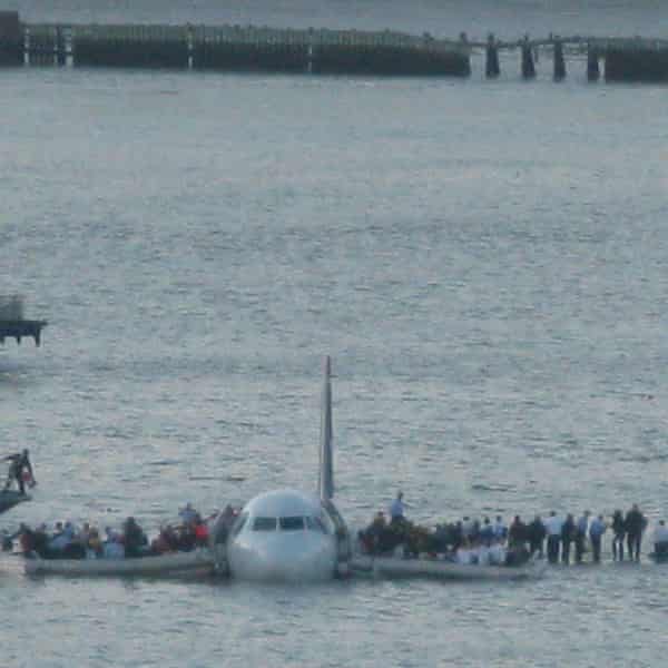 Passengers on the wings of a plane on the Hudson River