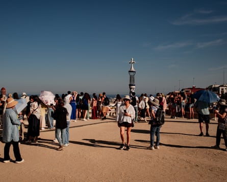 Visitors in Park Guell in Barcelona in June.