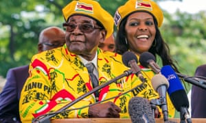 Zimbabwe’s president Robert Mugabe addresses Zanu-PF members gathered to show support for Grace Mugabe, right, becoming the party’s next vice president.