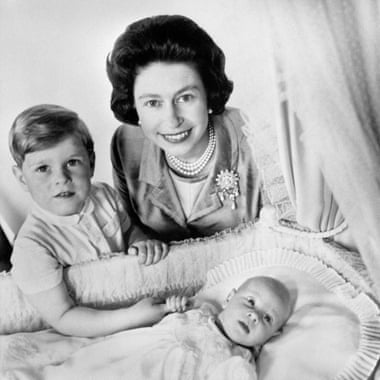 The Queen with the infant Prince Edward and four-year-old Prince Andrew in the Music Room at Buckingham Palace, 1964.