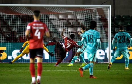 Lincoln City’s Tayo Edun scores his side’s first goal.