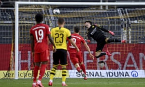 Borussia Dortmund's Roman Bürki cannot stop Joshua Kimmich’s chip for Bayern Munich