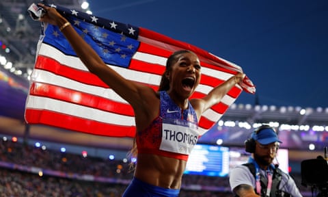 Gabby Thomas celebrates after winning the women's 200m