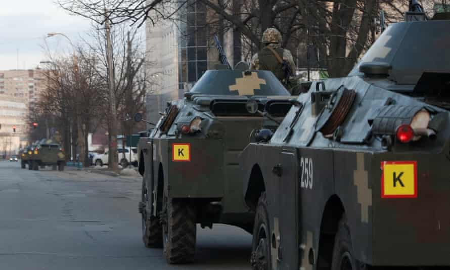 Ukrainian service members in armoured personal carriers