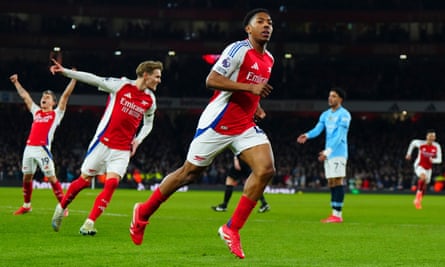 Myles Lewis-Skelly celebrates scoring.