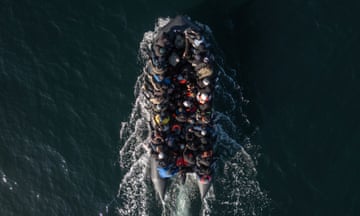 An inflatable dinghy carrying around 65 migrants crosses the English Channel on March 06, 2024