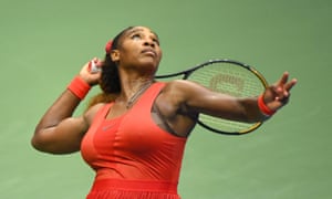 Serena Williams watches the ball during a serve.