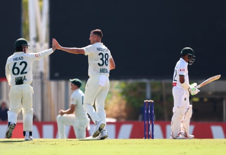 Josh Hazlewood celebrates dismissing Taijul Islam during day three of the first Test between Australia and Bangladesh