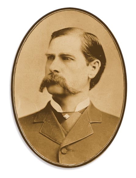 An old black-and-white photo of a man with an enormous moustachio