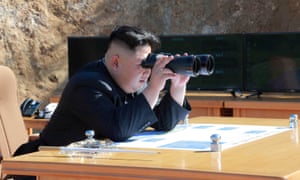 North Korean leader Kim Jong-un looks on during the test-fire of intercontinental ballistic missile Hwasong-14 in this undated photo.