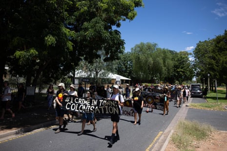 Invasion Day protesters march through the streets of Alice Springs, Australia