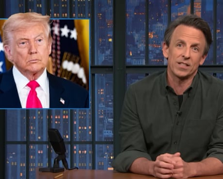 Seth Meyers at his talkshow desk.