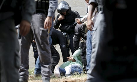 Israeli police detain a Palestinian man suspected of stabbing an Israeli in Jerusalem on 9 October, 2015.