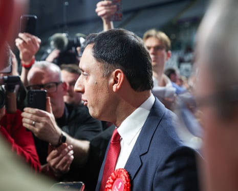Defeated Scottish Labour leader Anas Sarwar leaves the stage at the Glasgow International Arena