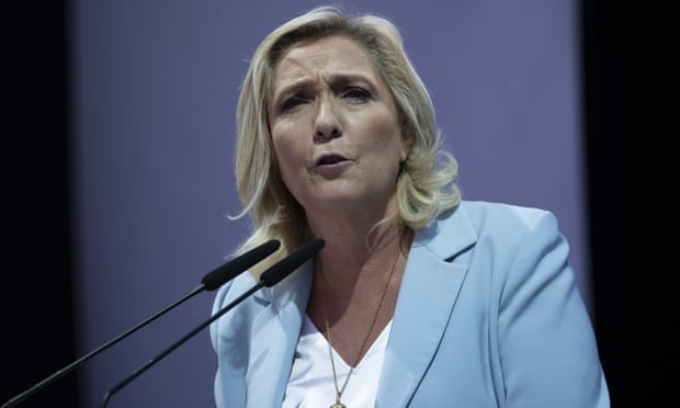 Marine Le Pen delivers a speech at a National Rally event in Frejús