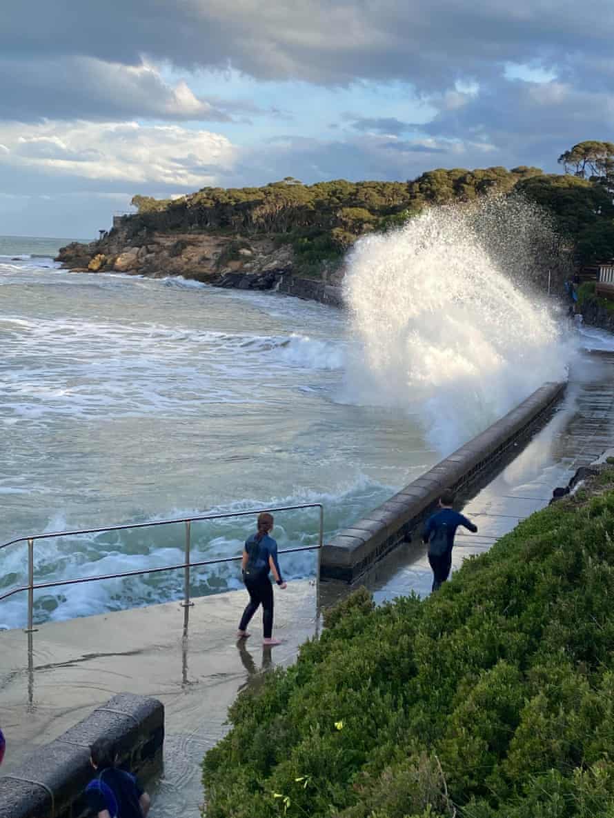Waves crash into the Point Lonsdale sea wall during a high tide