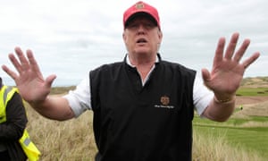 photo of Donald Trump wants to build a wall – to save his golf course from global warming | Dana Nuccitelli image