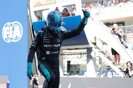 George Russell gives a thumbs up after taking pole position.